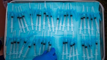 A nurse takes a Moderna Covid-19 vaccines ready to be administered in South Central Los Angeles, California on February 16, 2021. (AFP)