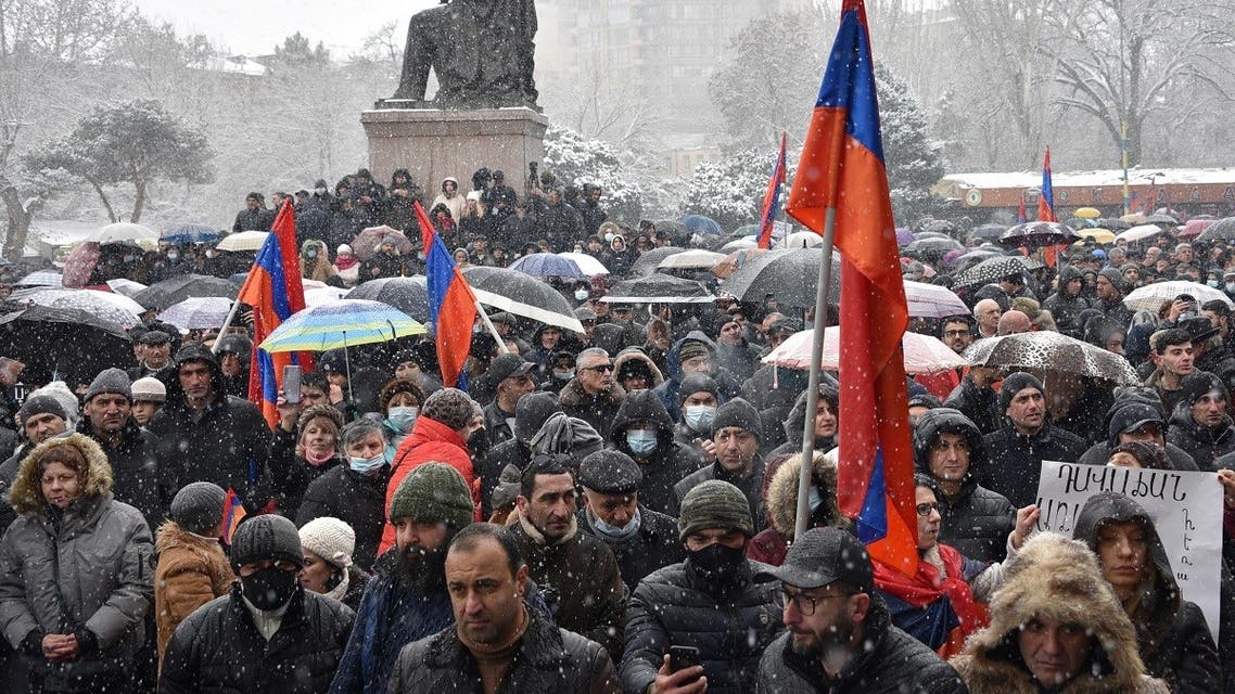 Supporters of opposition Dashnaktsutyun party take part in a rally to demand the resignation of their PM at the Freedom Square in central Yerevan on February 20, 2021. (Karen Minasyan/AFP)