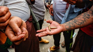 A person shows bullet shells during a protest against the military coup, in Mandalay, Myanmar, February 20, 2021. (Reuters)