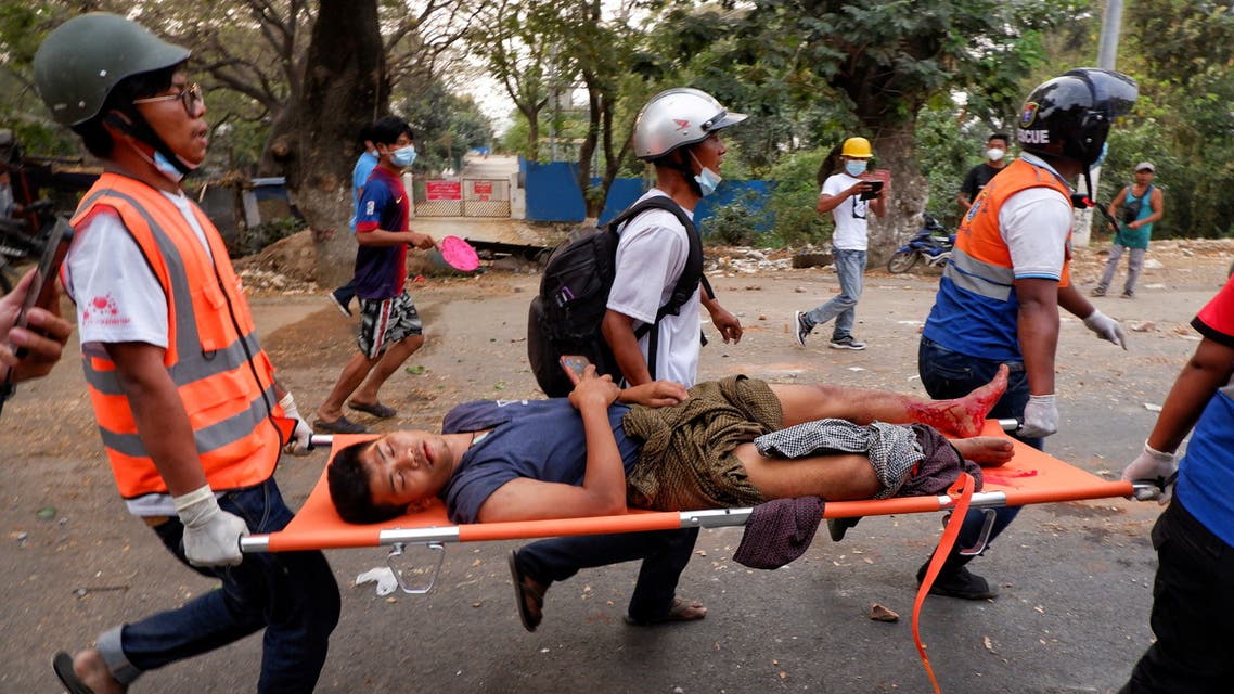 An injured man is carried by rescue workers after protests against the military coup, in Mandalay, Myanmar, February 20, 2021. (File photo: Reuters)