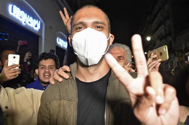 Algerian journalist Khaled Drareni is greeted by supporters upon his arrival to his home in his capital Algiers, following his release from the Kolea prison, on February 19, 2021. (AFP)