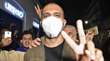 Algerian journalist Khaled Drareni is greeted by supporters upon his arrival to his home in his capital Algiers, following his release from the Kolea prison, on February 19, 2021. (AFP)