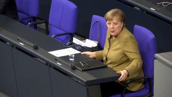 Watch: Angela Merkel panics after forgetting mask on lectern following speech 