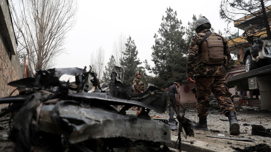  Security personnel inspect the site of a bomb attack in Kabul, Afghanistan, Saturday, Feb. 20, 2021. Three separate explosions in the capital Kabul on Saturday killed and wounded numerous people an Afghan official said. (AP Photo/Rahmat Gul)