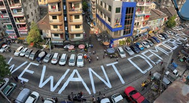 A slogan is written on a street as a protest after the coup in Yangon. (Reuters)