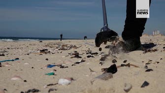 Israel's beaches blackened by tar after offshore oil spill