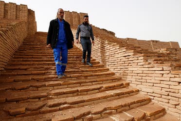 Men walk down the stairs of the Ziggurat of Ur ruins, ahead of the planned visit of Pope Francis, in Ur near Nassiriya, Iraq. (Reuters)