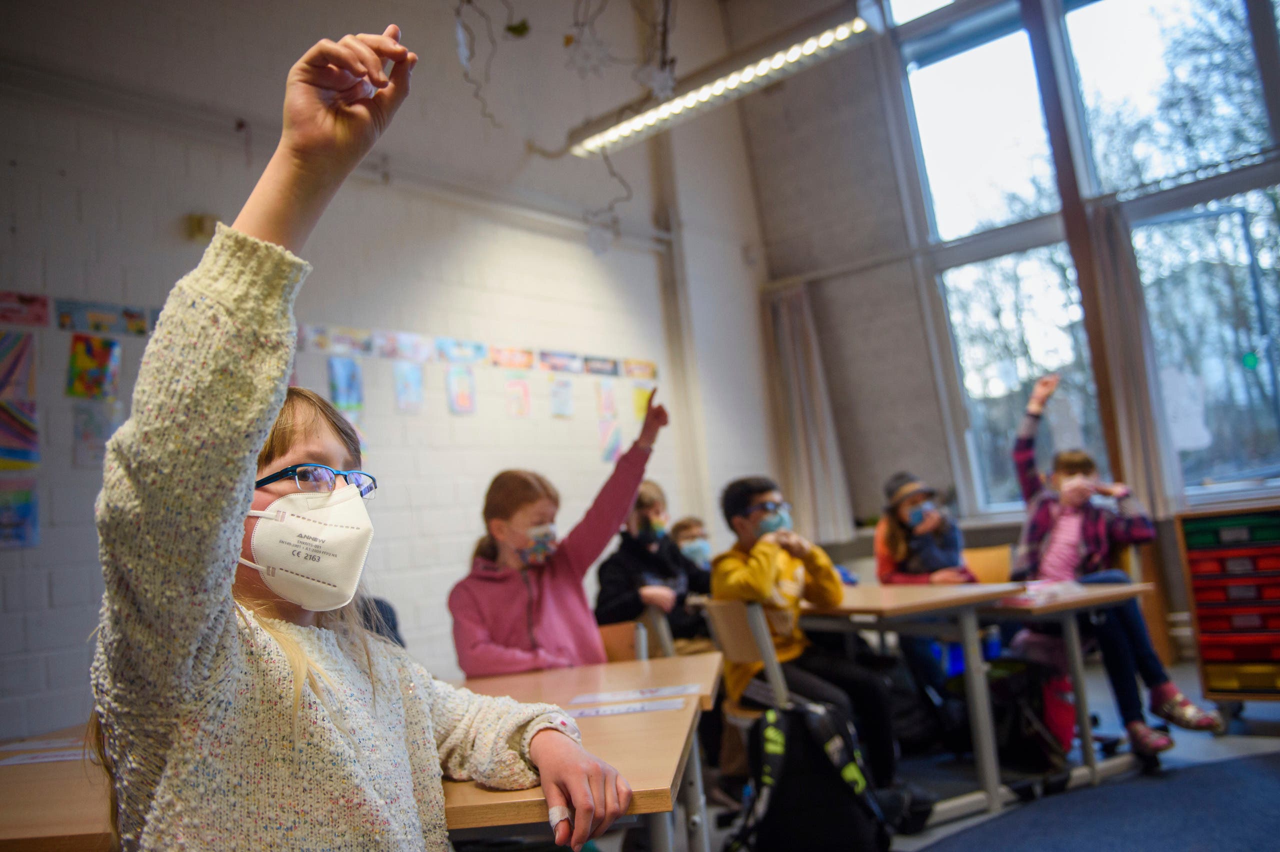 Pupils attend a lesson at the 'Russee' elementary school in Kiel, northern Germany, Monday, Feb. 22, 2021. (AP)