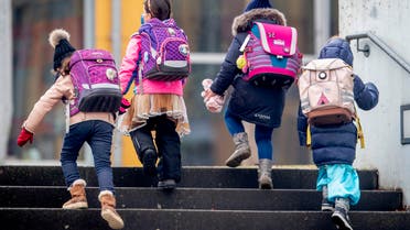 Pupils go to school in Frankfurt, Germany, Tuesday, Feb. 16, 2021. (AP)