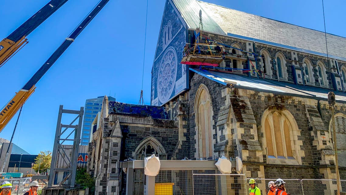 Construction staff work on the 2011 earthquake damaged Christ Church Cathedral in central Christchurch, New Zealand, on Feb. 11, 2021. The Christ Church Cathedral was arguably New Zealand's most iconic building before much of it crumbled during an earthquake 10 years ago. The years of debate that followed over whether the ruins should be rebuilt or demolished came to symbolize the paralysis that has sometimes afflicted the broader rebuild of Christchurch. But as the city on Monday, Feb. 22 marks one decade since the quake struck, killing 185 people and upending countless more lives, there are finally signs of progress on the cathedral. It's being rebuilt to look much like the original that was finished in 1904, only with modern-day improvements to make it warmer and safer. (AP Photo/Nick Perry)