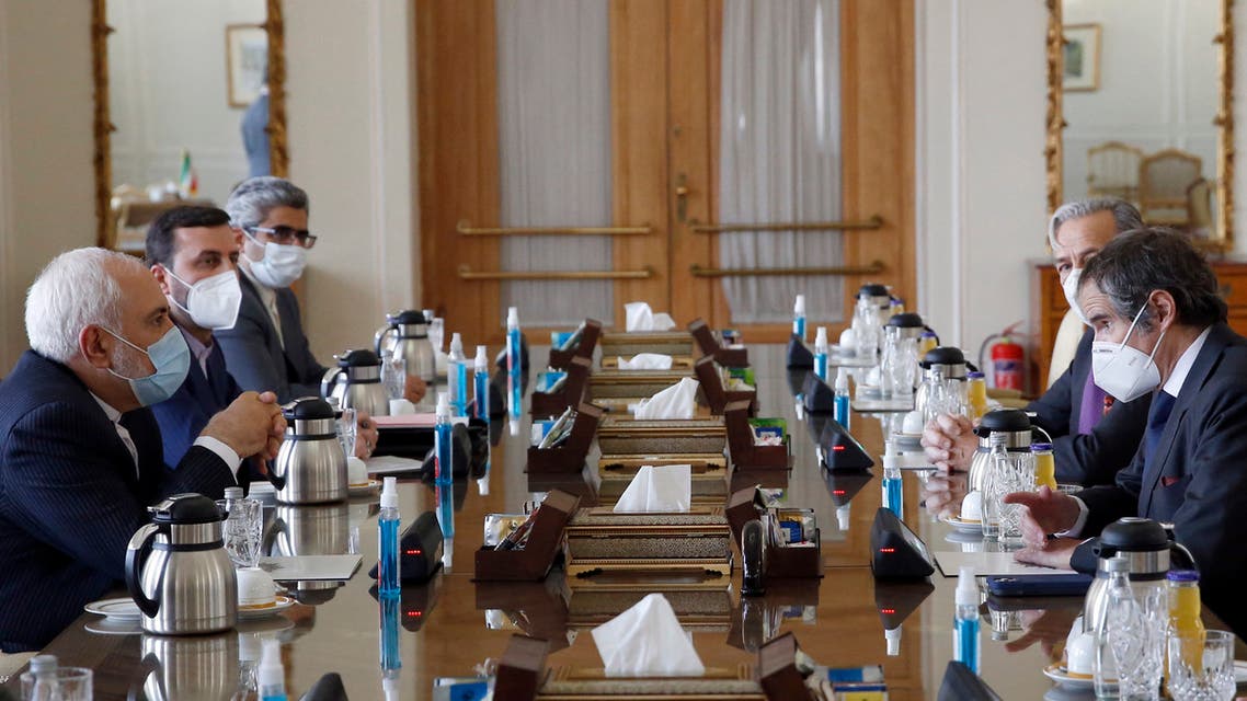 Iran' Foreign Minister Mohammad Javad Zarif (L) meets with the director general of the International Atomic Energy Agency (IAEA), Rafael Grossi (R), in Tehran on February 21, 2021. Iran said it had held fruitful discussions with the UN nuclear watchdog chief, ahead of a deadline when it is set to restrict the agency's inspections unless the United States lifts painful sanctions.