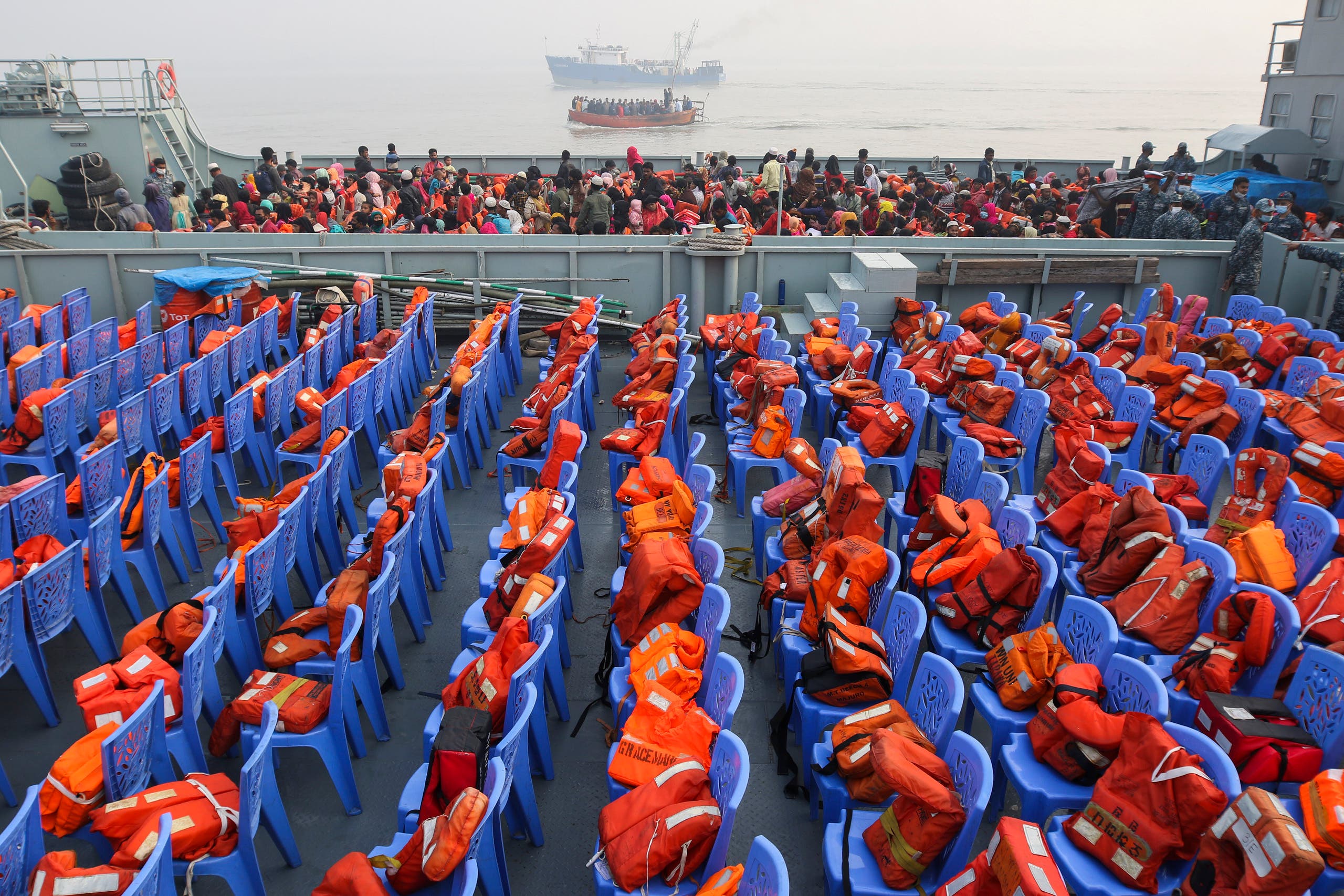 Life vests are placed on chairs as Rohingya refugees headed to the Bhasan Char island arrive to board navy vessels from the south eastern port city of Chattogram, Bangladesh, Monday, Feb.15,2021. (AP)