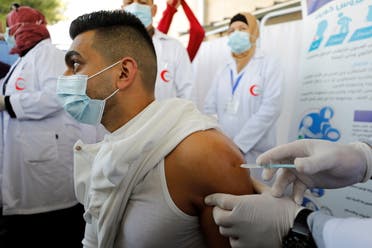 Palestinian health workers are vaccinated against COVID-19 in Bethlehem. (Reuters)