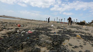 Tar is seen on the beach in the aftermath of an oil spill that drenched much of the Mediterranean, in Tyre nature reserve, Lebanon February 22, 2021. (Reuters/Aziz Taher)