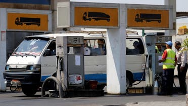 A microbus is filled up with fuel by an employe at a petrol station in Cairo, Egypt June 29, 2017. (Reuters/Amr Abdallah Dalsh)