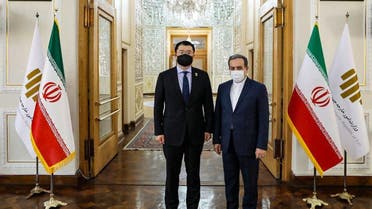 A handout picture provided by the Iranian foreign ministry on January 10, 2021, shows South Korea's Deputy Foreign Minister Choi Jong-kun (L) meeting with his Iranian counterpart Abbas Araghchi, in the Iranian capital Tehran. (AFP)