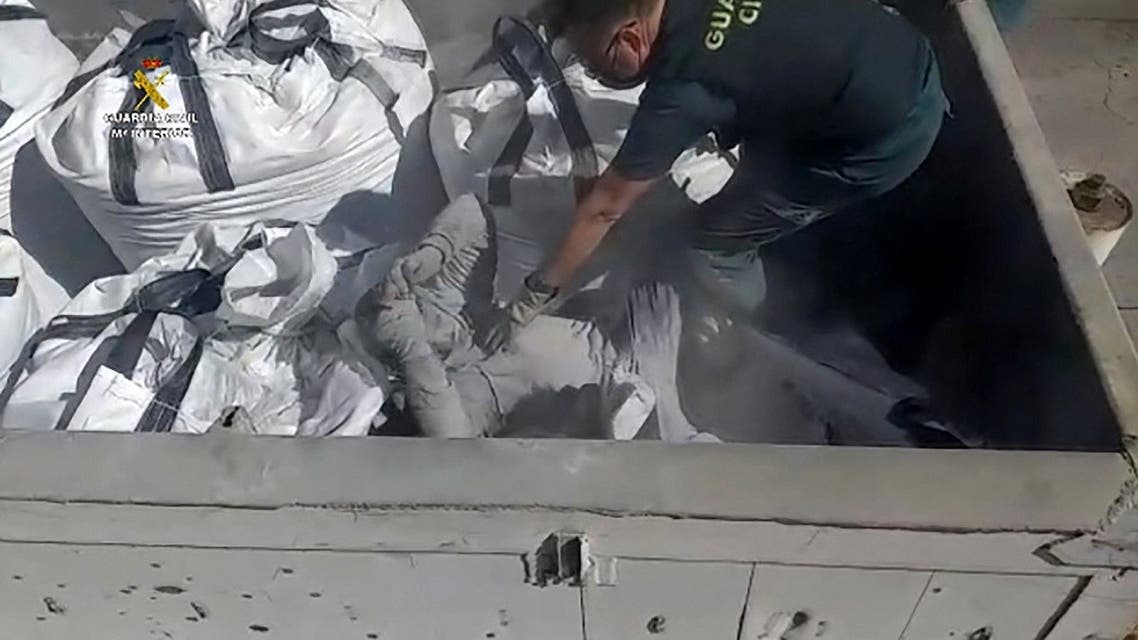 An handout image released by the Spanish Guardia Civil on February 22, 2021 shows an aspiring migrant hidden in a sack of toxic waste at the port in Spain's Melilla enclave on February 19, 2021. (Spanish Guardia Civil/AFP)