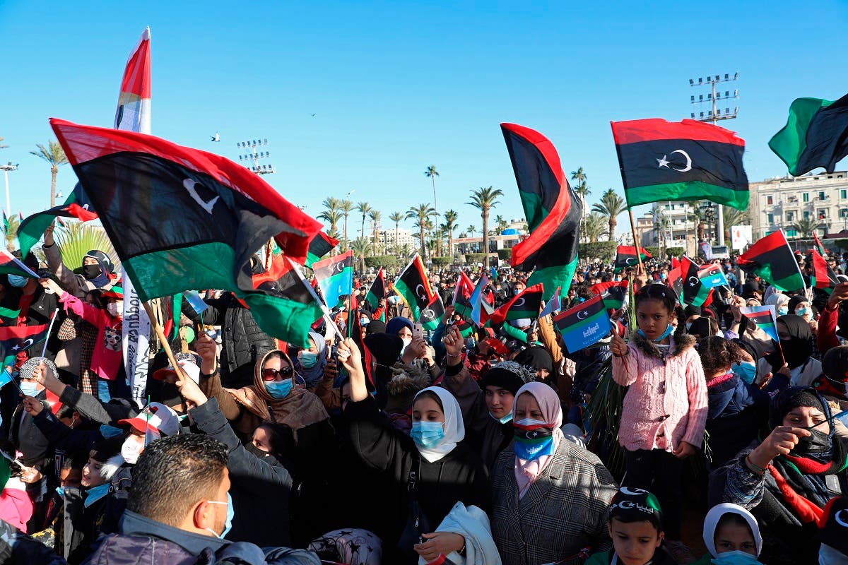 Libyans mark the 10th anniversary of their 2011 uprising that led to the overthrow and killing of longtime dictator Moammar Gadhafi in Martyrs Square, Tripoli. (AP)