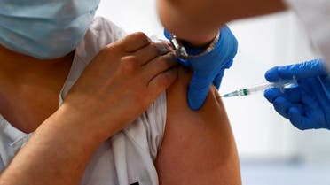 A health worker receives a dose of the Pfizer-BioNTech COVID-19 vaccine in Madrid, Spain. (File photo: Reuters)