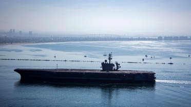 n this image released by the US Navy, the aircraft carrier USS Theodore Roosevelt returns to Naval Air Station North Island in San Diego, California, on July 9, 2020. (AFP)