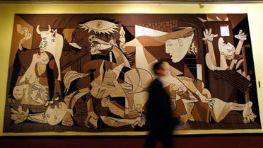 A man walks by Spanish artist Pablo Picasso's 'Guernica' at the United Nations headquarters in New York August 10, 2005. (Reuters)