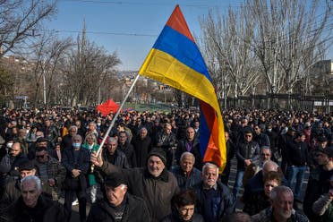 Opposition supporters rally outside the National Assembly building to demand the Prime Minister’s resignation over his handling of last year’s war with Azerbaijan, in Yerevan on February 27, 2021. (Karen Minasyan/AFP)