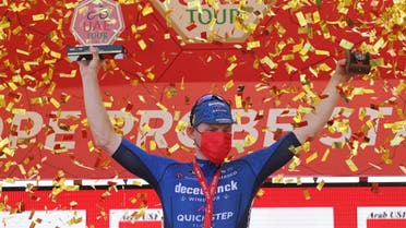 Sam Bennett of Deceuninck Quick Step team stands on the podium after winning the fourth stage of the UAE Cycling Tour at al-Marjan Island on February 24, 2021. (AFP)