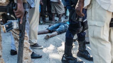 The body of a dead inmate lies on the pavement by the Croix-des-Bouquets prison from where many prisoners escaped and where several people were killed, in Croix-des-Bouquets, suburb of the Haitian capital, on February 25, 2021. Multiple people were killed February 25 in Haiti, including the director of a prison in the suburbs of capital Port-au-Prince, after several inmates escaped, police said. (File photo: AFP)