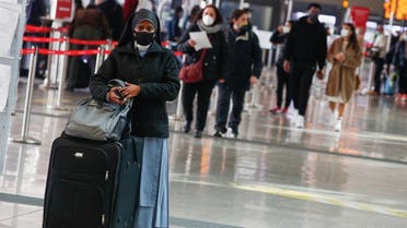 A commuter at Rome's main train station Termini wears a mask, amid the coronavirus disease (outbreak, in Rome, Italy, February 22, 2021. (Reuters/Guglielmo Mangiapane)