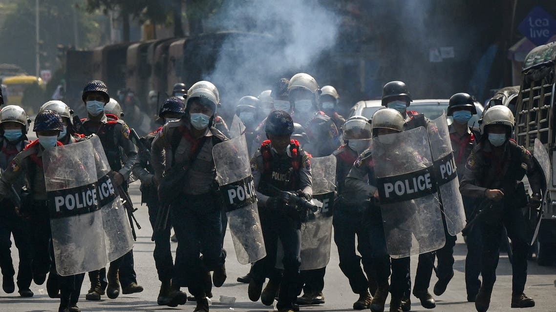 Police fire tear gas as they attempt to disperse protesters taking part in a demonstration against the military coup in Yangon on February 27, 2021. Ye Aung THU / AFP
