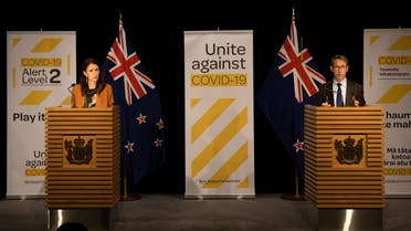 New Zealand's Prime Minister Jacinda Ardern (L) and New Zealand's health department director-general Ashley Bloomfield (R) take part in a press conference about the COVID-19 coronavirus at Parliament in Wellington on June 8, 2020. (File photo: AFP)