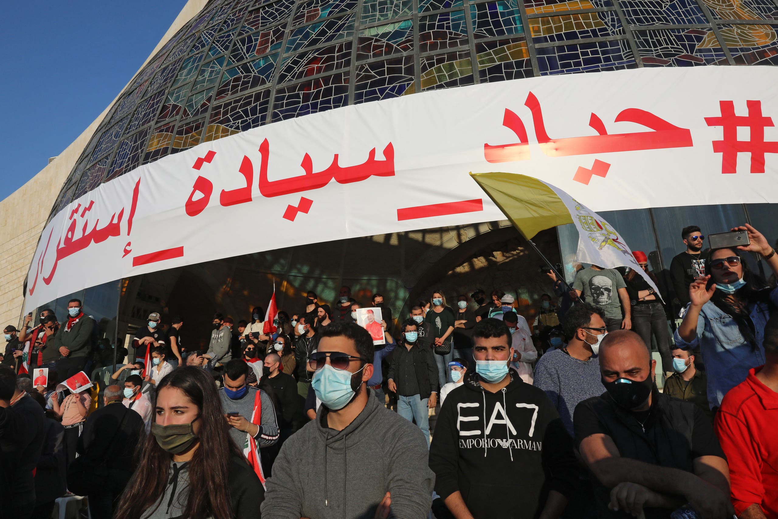 Lebanese protesters gather for the speech of Lebanon's Cardinal Mar Bechara Boutros al-Rahi (or Rai) on February 27, 2021 at the Maronite Patriarchate in the mountain village of Bkerki, northeast of Beirut. (AFP)
