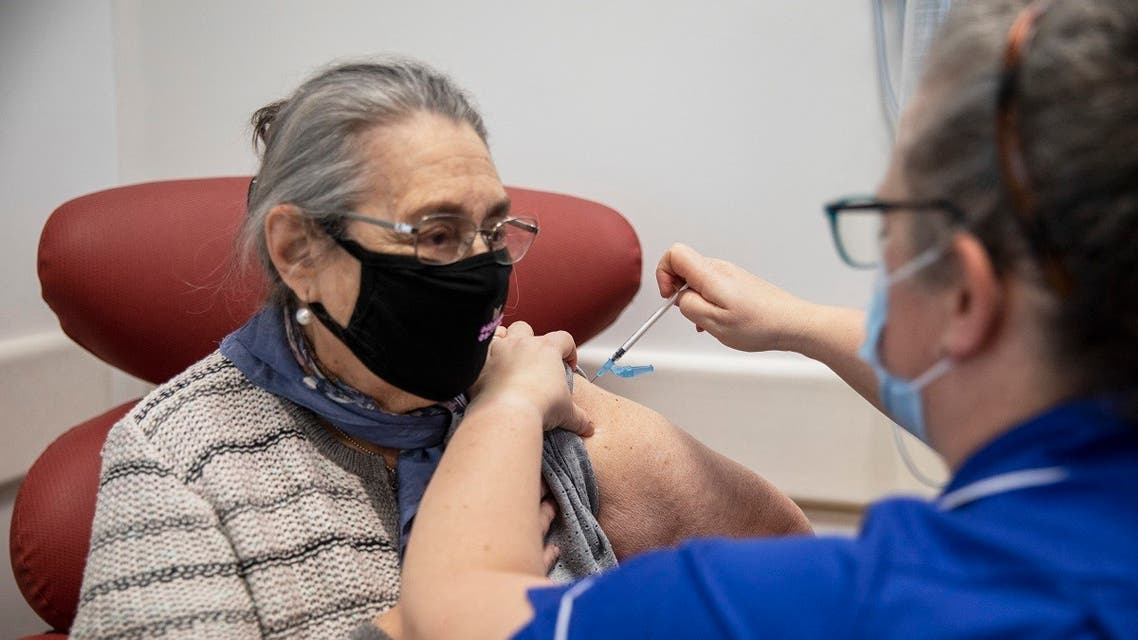 Nurse Naomi Walsh (R) administers the Pfizer-BioNTech COVID-19 vaccine to Bernice Wainer, 82 at the Royal Free hospital in London on December 8, 2020. (Jack Hill/Pool/AFP)