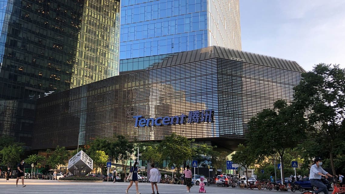 People are seen in front of the Tencent company headquarters in Shenzhen, Guangdong province, China August 7, 2020. (Reuters)