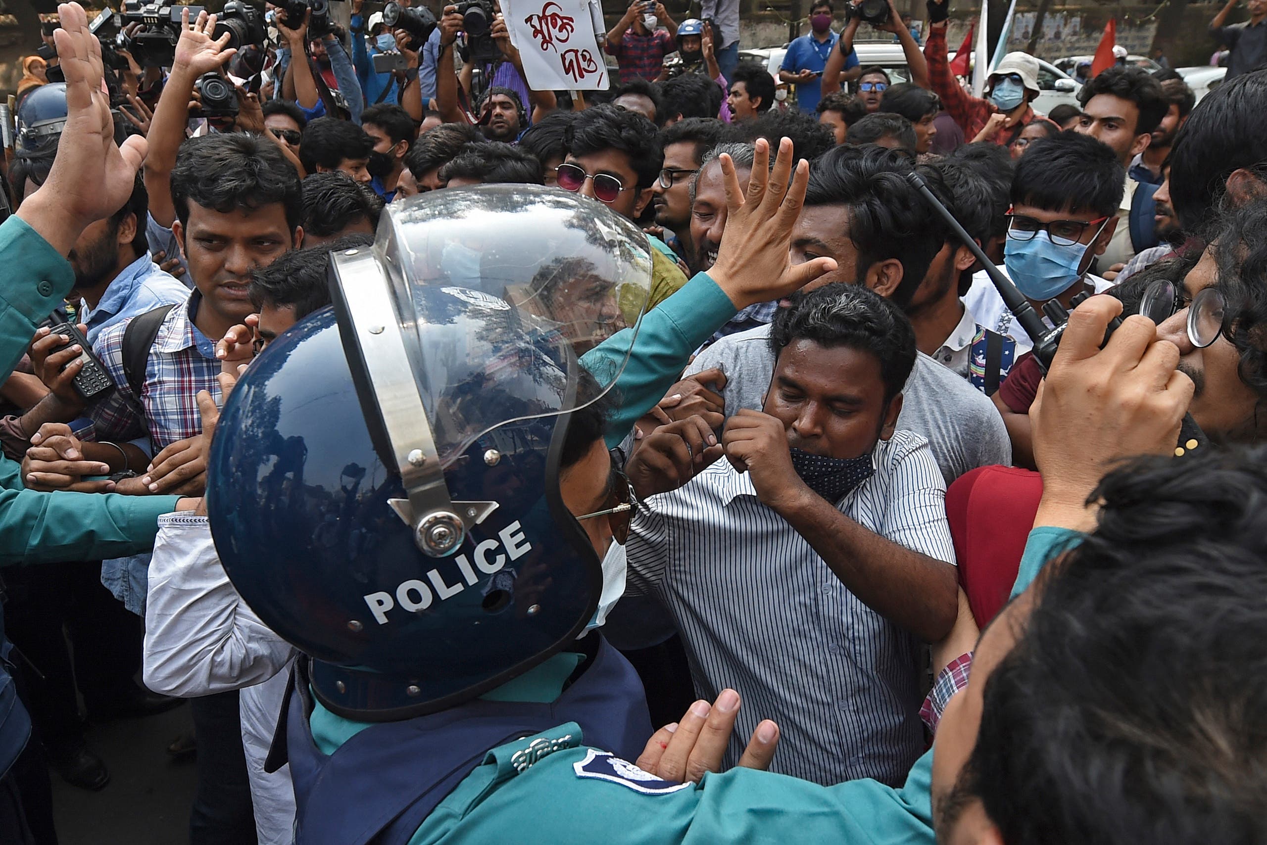 Activists from the left parties scuffle with the police during a demonstration in Dhaka on March 1, 2021, following the death of writer Mushtaq Ahmed in jail months after his arrest. (AFP)