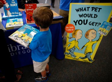 Three year-old Justin Jilka holds his new copy during the release of the Dr. Seuss book What Pet Should I Get? at the University of California San Diego's Geisel Library in San Diego, California July 28, 2015. (Reuters)