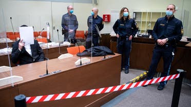 The defendant Muharrem D. (L), an alleged member of ISIS, waits for the opening of his trial on March 2, 2021 in Munich, southern Germany. (Sven Hoppe/Pool/AFP)