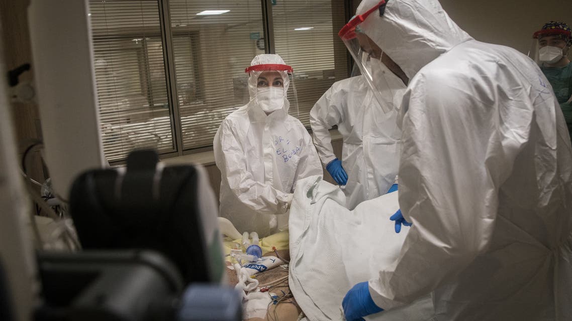 Doctors assist a COVID-19 patient at the Kartal Dr. Lutii Kirdar Education and Research Hospital, Intensive Care Unit (ICU) on May 08, 2020 in Istanbul, Turkey. (AFP)