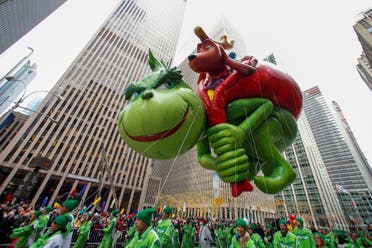 The Dr Seuss’ The Grinch balloon is carried during the 93rd Macy's Thanksgiving Day Parade in New York, US, November 28, 2019. (Reuters)