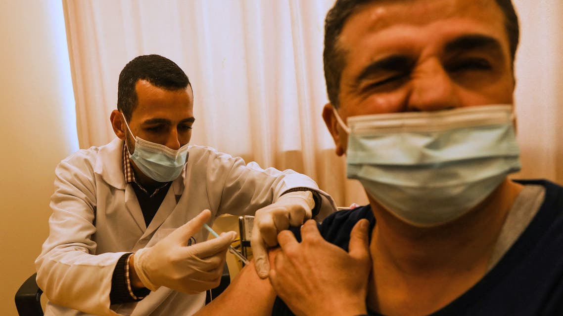 An employee of the United Nations Relief and Works Agency for Palestine Refugees (UNRWA) gives a shot of the Sputnik V Covid-19 vaccine for medical staff at UNRWA's al-Sheikh Redwan clinic in Gaza City, on February 25, 2021. (File photo: AFP)