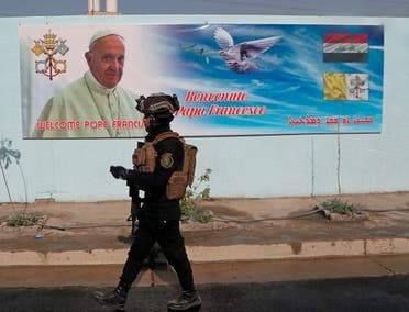 A member of the Iraqi armed forces guards outside St. Joseph Chaldean Church during preparations for Pope Francis' upcoming trip to Iraq, March 3, 2021. (AP) 