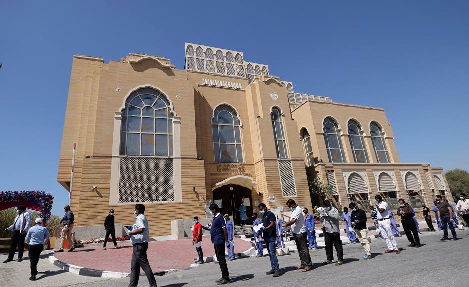 Members of Dubai's Indian community queue to receive their shot of China's Sinopharm COVID-19 vaccine the Guru Nanak Darbar Gurudwara (Sikh temple) in Dubai on February 28, 2021. (File photo: AFP)