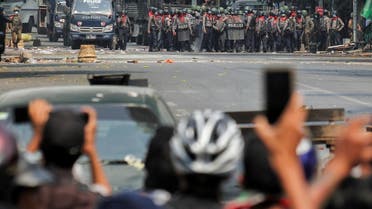 Police stand on a road during an anti-coup protest in Mandalay, Myanmar, March 3, 2021. (Reuters)