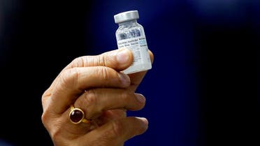 Indian Health Minister Harsh Vardhan holds a dose of Bharat Biotech's COVID-19 vaccine called COVAXIN, in New Delhi, India, January 16, 2021. (Reuters/Adnan Abidi)