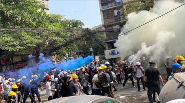 Protesters set off smoke grenades to block the view from snipers in Sanchaung, Yangon, Myanmar March 3, 2021, in this still image from a video obtained by Reuters. Video obtained by REUTERS. ATTENTION EDITORS - THIS IMAGE HAS BEEN SUPPLIED BY A THIRD PARTY. NO RESALES. NO ARCHIVES.