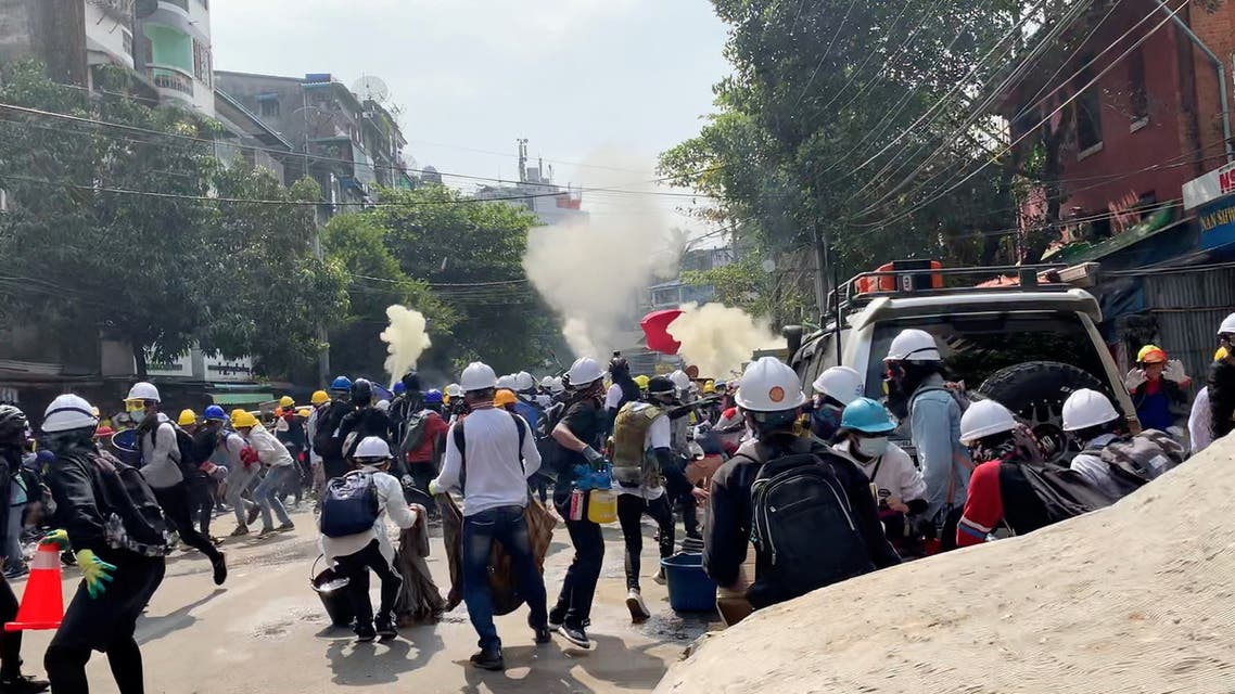 Protesters set off smoke grenades to block the view from snipers in Sanchaung, Yangon, Myanmar March 3, 2021, in this still image from a video obtained by Reuters. Video obtained by REUTERS. ATTENTION EDITORS - THIS IMAGE HAS BEEN SUPPLIED BY A THIRD PARTY. NO RESALES. NO ARCHIVES.