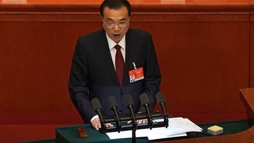 Chinese Premier Li Keqiang delivers a speech during the opening session of China's National People's Congress (NPC) at the Great Hall of the People in Beijing, Friday, March 5, 2021. (AP)