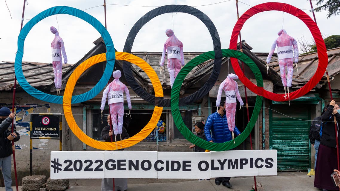 Exile Tibetans use the Olympic Rings as a prop as they hold a street protest against the holding of 2022 Winter Olympics in Beijing in Dharmsala, India, Wednesday, Feb. 3, 2021. (File photo: AP)