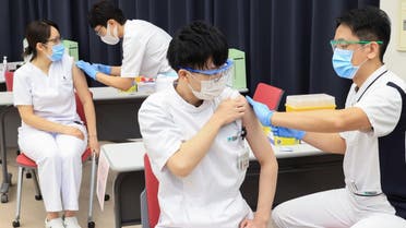 Medical workers receive doses of the vaccine against the coronavirus disease (COVID-19) at the Tokyo Metropolitan Cancer and Infectious Diseases Center Komagome Hospital in Tokyo, Japan, on March 5, 2021. (Reuters))