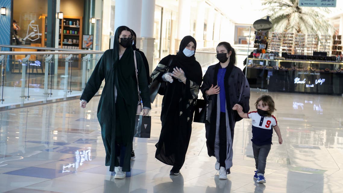 Women wear face masks as they walk at the Hayat mall after restaurants and malls reopened as the government eases the coronavirus lockdown restrictions, in Riyadh, Saudi Arabia June 1, 2020. (Reuters)